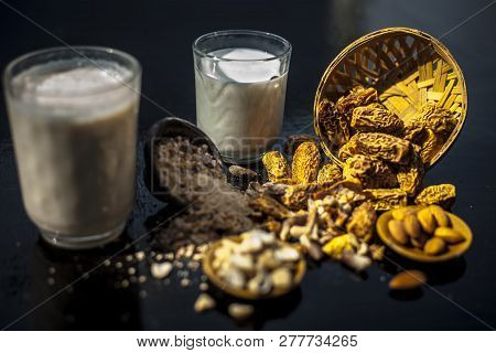 Close Up Of Popular Indian And Asian Winter Drink On Wooden Surface I.e. Kharek Ka Dudh Or Dried Dat