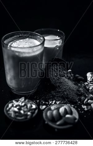 Close Up Of Popular Indian And Asian Winter Drink On Wooden Surface I.e. Kharek Ka Dudh Or Dried Dat