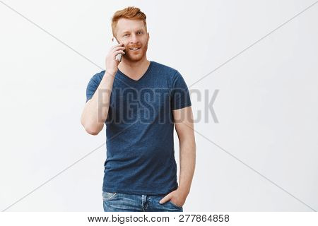Good-looking Mature Redhead Masucline Husband Making Arrangement In Restaurant Via Smartphone, Stand