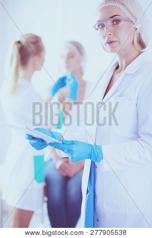 Portrait Of Female Standing Near Open Fridge Full Of Healthy Food, Vegetables And Fruits. Portrait O