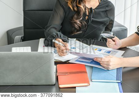 Resume Or Recruitment. Businesswoman And Partner Examining Or Analyzing Resume Documents On Desk At