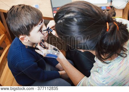 Little Cute Child Making Facepaint On Birthday Party, Zombie Apocalypse Facepainting, Halloween Prep