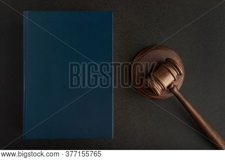 Legal Judge Hammer Or Mallet And Law Books On Black Background. Jurisprudence. Laws And Justice.