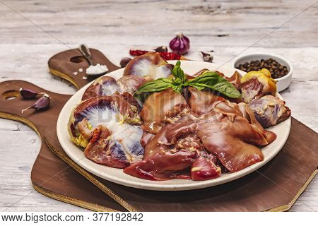 Fresh Raw Chicken Offal: Heart, Liver, Stomach With Dry Spices, Sea Salt, Chili Pepper On Wooden Tab