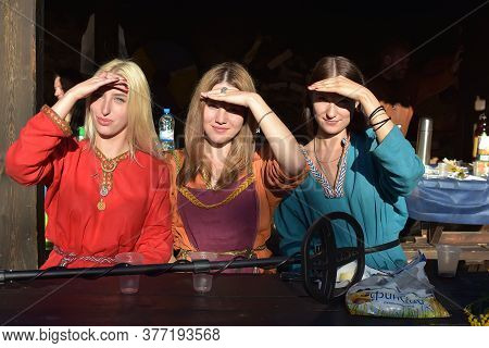 Three Girls Dressed In Historical Medieval Reconstruction Varangian Manor, Russia