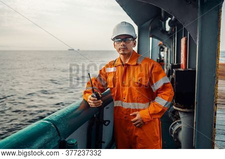 Filipino Deck Officer On Deck Of Vessel Or Ship , Wearing Ppe Personal Protective Equipment