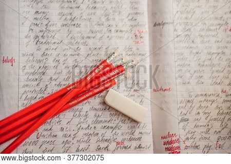 Vietnam, Nha Trang, 14.07.2020: Ielts Red Pencils And Essay Notebook For The English Exam