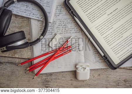 Vietnam, Nha Trang, 14.07.2020: Ielts Red Pencils, Reading Text And Listening Headphones And Essay N