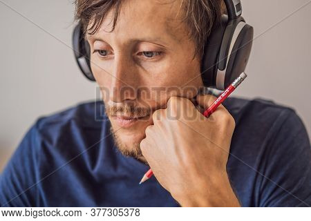 Vietnam, Nha Trang, 14.07.2020: A Man Prepares For The Ielts Exam Ielts Red Pencils, Reading Text An