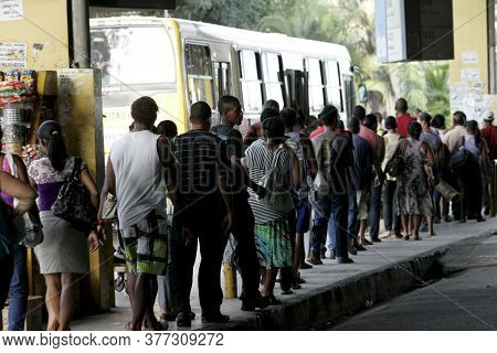 Salvador, Bahia / Brazil - April 4, 2013: Passengers Are Seen In Line To Board Public Transport Buse