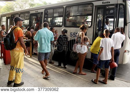 Salvador, Bahia / Brazil - April 4, 2013: Passengers Are Seen In Line To Board Public Transport Buse