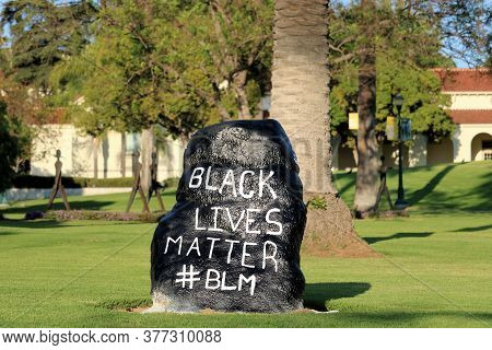 July 23, 2020 In Whittier, Ca:  Black Lives Matter Sign On A Manicured Lawn With Spanish Style Build