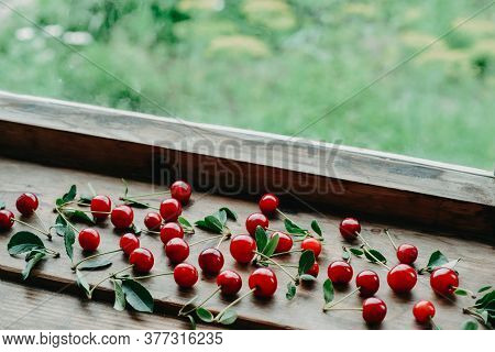 Ripe Cherries On A Wooden Windowsill. Cottagecore Aesthetics. Rustic, Vintage Style Juicy Summer Con