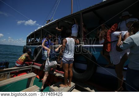 Salvador, Bahia / Brazil  - January 31, 2019: Passengers Are Seen At The Pier Of Ilha Dos Frades Sch