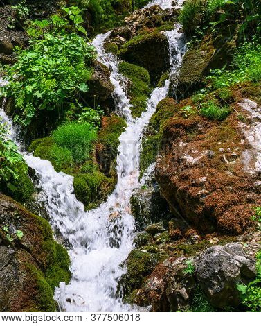 Foamy Valley Waterfall In Bucegi Mountains Accessible From Busteni Town. Long Exposure Picture Of A