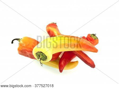 Yellow And Red Chili Peppers On White Background