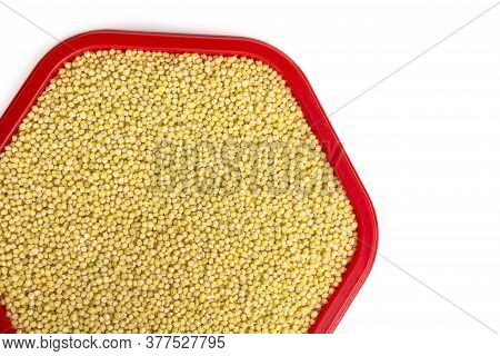 Millet In A Container On A White Background Top View