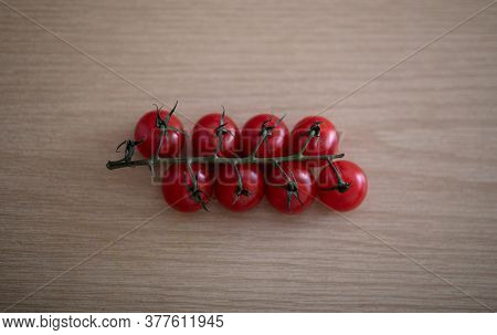 Tomato. Tomatoes Group On Wooden Table Background.