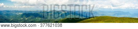 Mountain Panorama On A Summer Day. Hills Rolling From The Valley Up In To The Distance. View Of The 