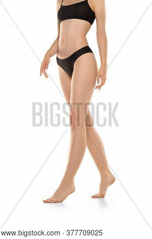 Beautiful Female Legs, Buttlocks And Belly Isolated On White Background. Beauty, Cosmetics, Spa, Dep