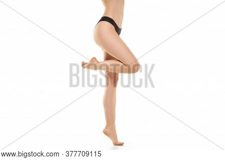 Beautiful Female Legs, Buttlocks And Belly Isolated On White Background. Beauty, Cosmetics, Spa, Dep