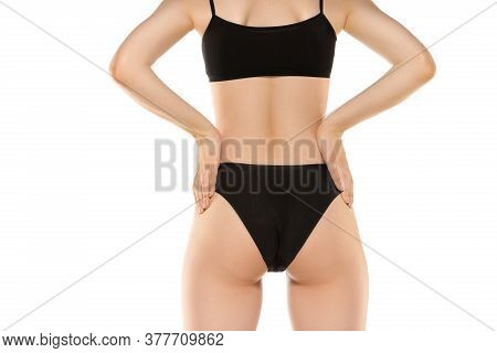 Close Up. Beautiful Female Legs, Buttlocks Isolated On White Background. Beauty, Cosmetics, Spa, Dep