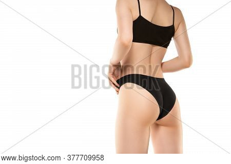 Close Up. Beautiful Female Legs, Buttlocks Isolated On White Background. Beauty, Cosmetics, Spa, Dep