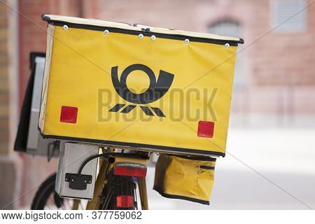 Logo Of German Mail - Deutsche Post - On Yellow Background On Bicycle - Selective Focus