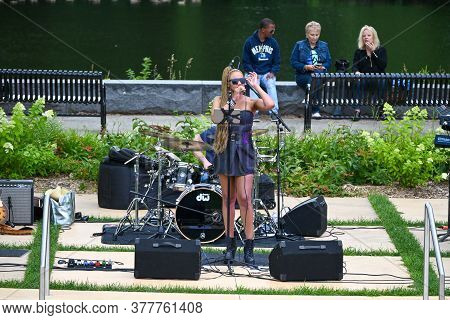 Anoka, Mn/july 22, 2020. The Lead Singer Performing With A Band At A Free Community Concert In A Pub