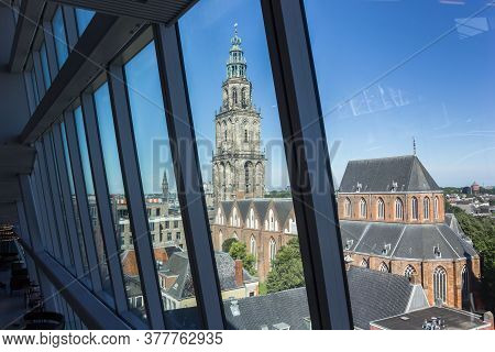 Groningen, Netherlands - July 13, 2020: Tower Of The Historic Martini Church Through The Windows Of 