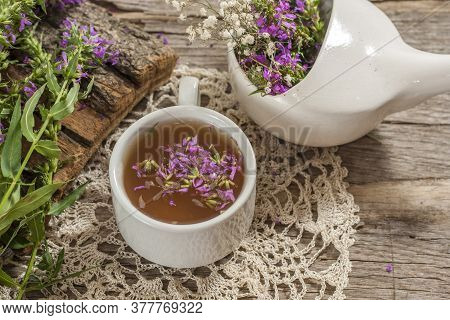 Fireweed Is A Healthy Herbal Tea. Mug Of Traditional Russian Drink Ivan Tea On A Wooden Background W
