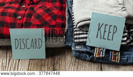 Stack Of Old Clothes To Discard (declutter) Or Keep. Recycle Clothes, Eco Cotton.