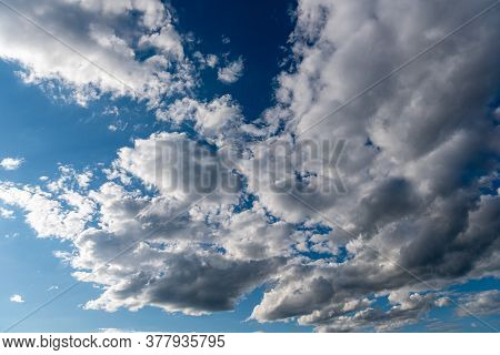 White Fluffy Clouds In The Blue Sky