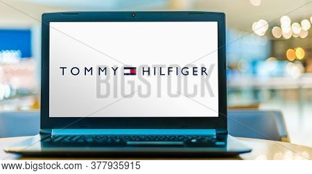 Laptop Computer Displaying Logo Of Tommy Hilfiger