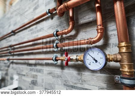 Plumbing service. copper pipeline of a heating system in boiler room