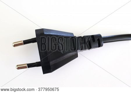 Isolated Electrical Black And White European Plugs On A White Background