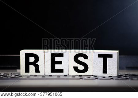 Rest Word From Wooden Blocks On Desk