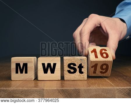 A Businessman Exchanges A Wooden Cube With 19% Tax For One With 16% Tax. Economic Stimulus Package F