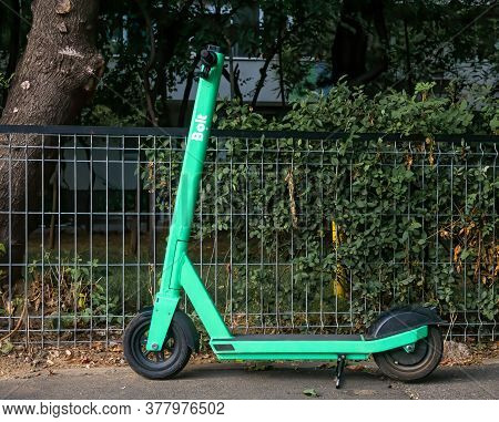 Bucharest/romania - 07.15.2020: Parked Electric Scooter For Rental In Bucharest Belonging To Ride Ha