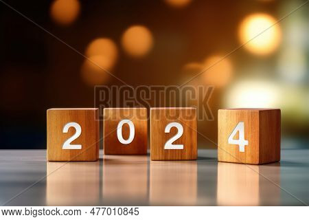 The Year 2024 Text On Wooden Cube. A New Era Of Creative Inspiration And Concept Background. Make A
