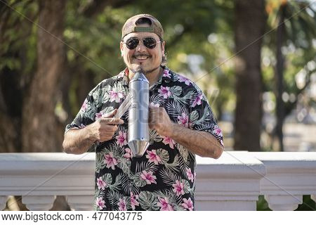 Hispanic Artist Playing Güiro In The Street