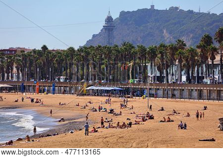 Barcelona, Spain - October 7, 2021: People Spend Time On Barceloneta Beach In Barcelona, Spain. Barc