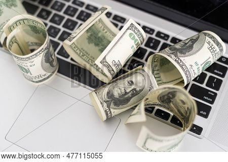 Us Hundred Dollar Bills On White Modern Computer Keyboard.