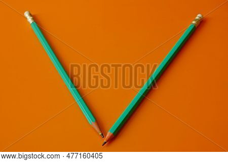 Lead Pencils On An Orange Background. Shool, Paint, Education