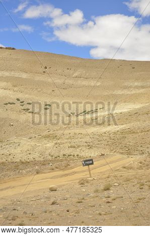 Wooden Sign Board Of Padum In Rough Road In Between Darcha-padum Road, Ladakh, India.