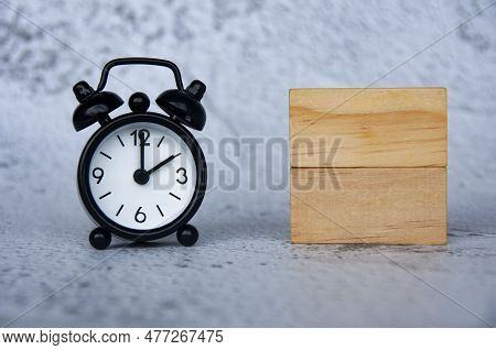 Alarm Clock With Wooden Blocks With Customizable Space For Text. Copy Space