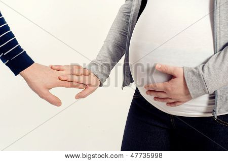 Close Up Of A Belly Of The Pregnant Woman