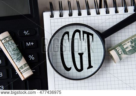 Letters Cgt (capital Gains Tax) Under A Magnifying Glass On A White Notebook Against The Background 