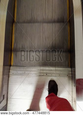 Be Careful : Person Steps  On The Escalator  Moves Down Very Quickly   And  Person Can Lose Balance 
