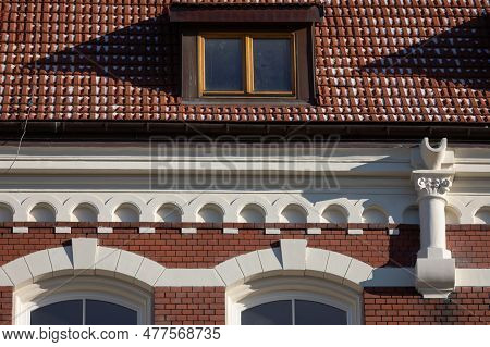 A Small Section Of The Roof And Cornice Of A Historic Neo-gothic-style Building.
